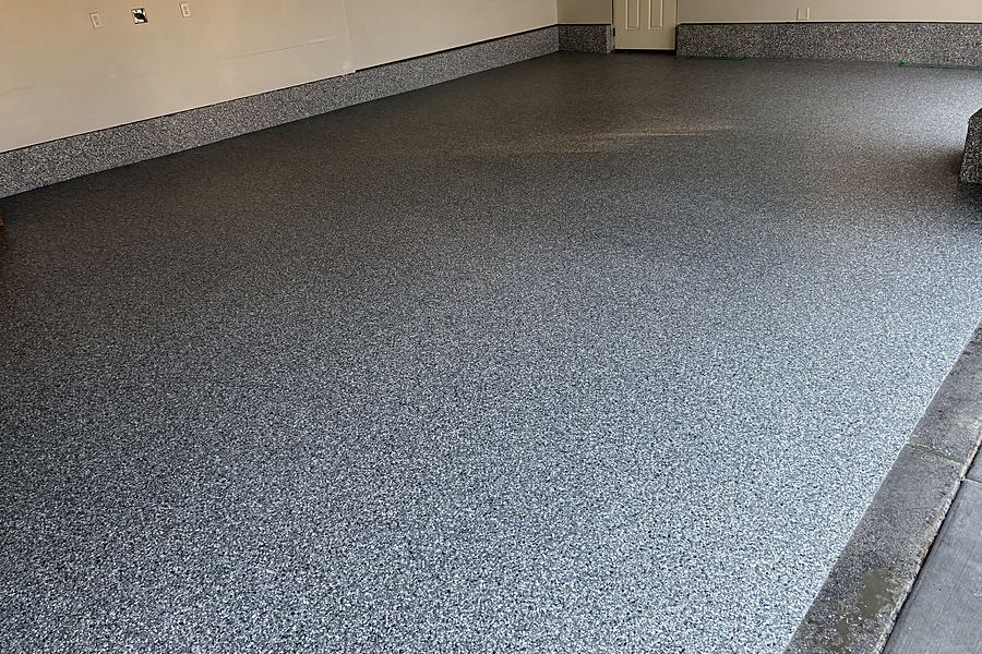 A close view of a finished light grey flake floor