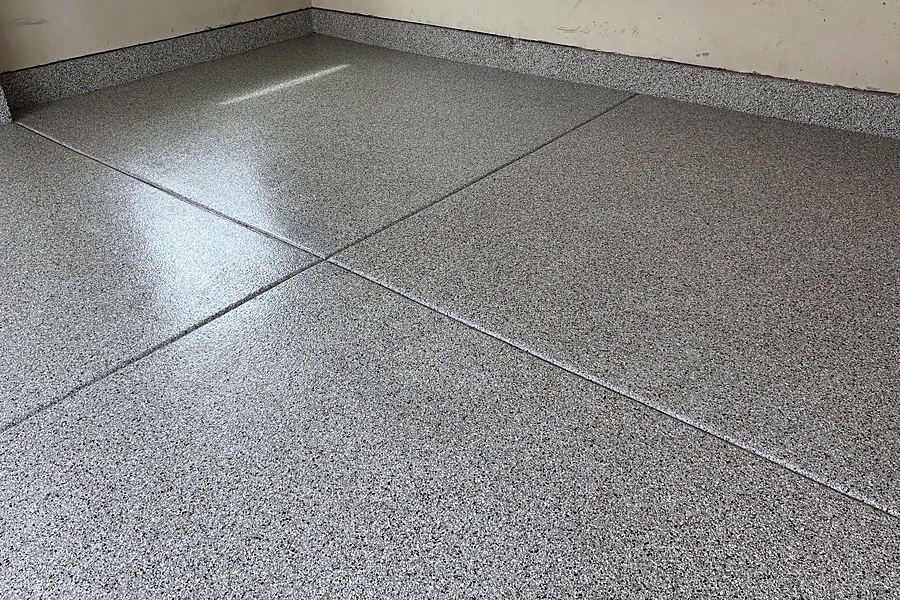 A close view of the flake and polyaspartic topcoat surface